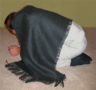 kneeling in sackcloth